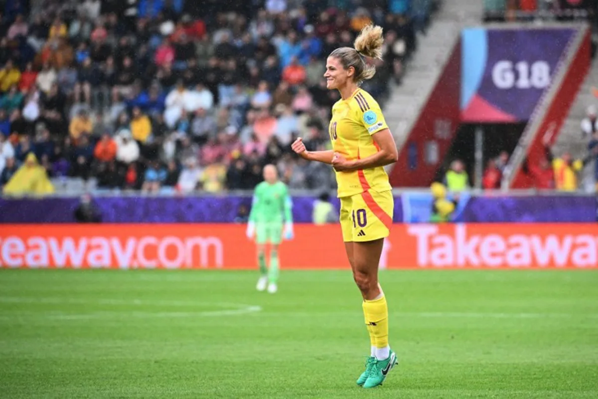 Belgium's midfielder #10 Justine Vanhaevermaet (C) celebrates  after scoring her team's first goal during the UEFA Women's Euro 2025 Group B football match between Spain and Belgium at the Arena Thun stadium in Thun on July 7, 2025.   SEBASTIEN BOZON / AFP