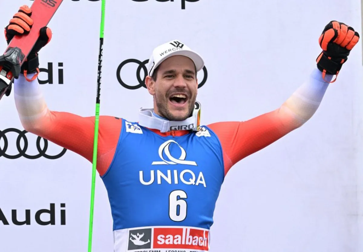 Switzerland's Thomas Tumler celebrates on the podium after the men's Giant Slalom event of FIS Ski Alpine World Cup in Saalbach, Austria on March 16, 2024.  Joe Klamar / AFP