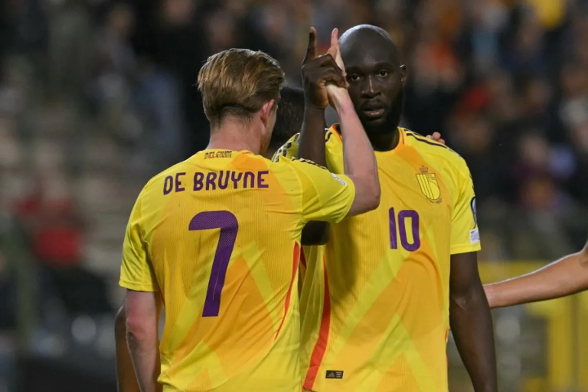 Belgium's forward #10 Romelu Lukaku celebrates with Belgium's midfielder #07 Kevin De Bruyne (L) after scoring Belgium's fourth goal during the FIFA World Cup 2026 Group J European qualification football match between Belgium and Wales at the King Baudouin Stadium in Brussels, on June 9, 2025. NICOLAS TUCAT / AFP