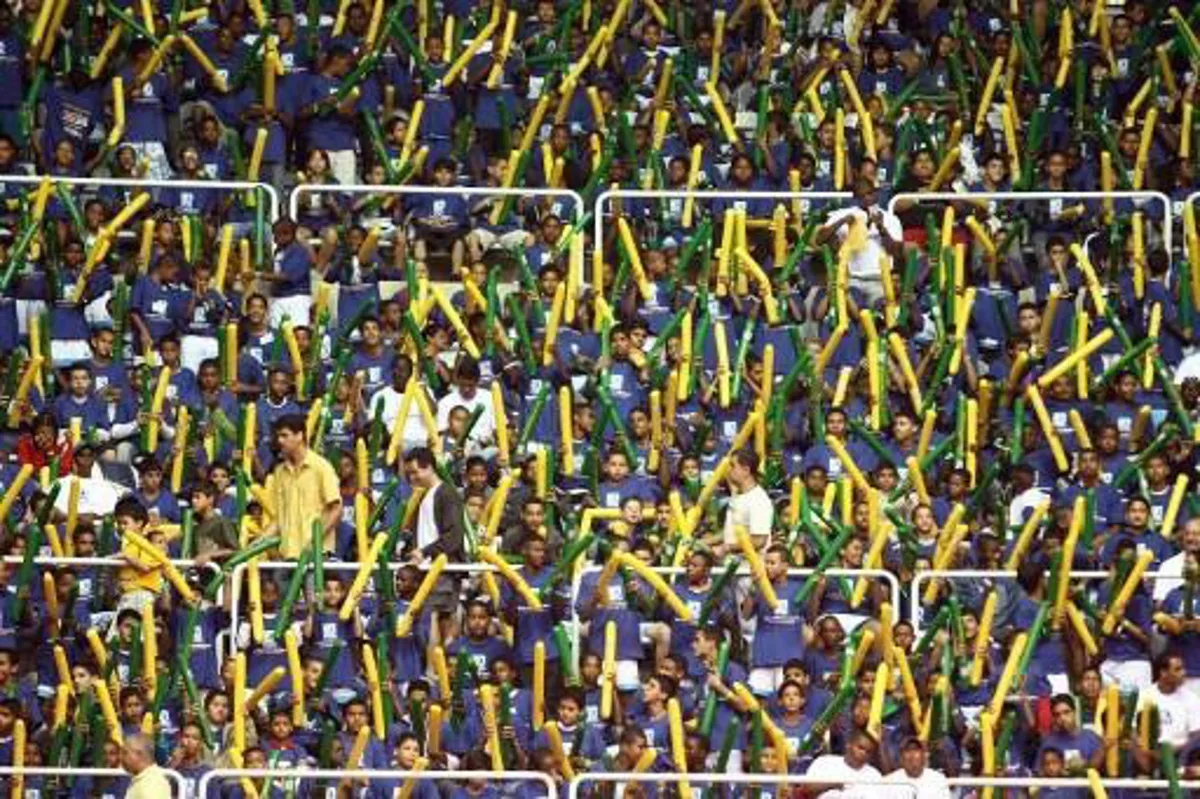 Brazilian's futsal fans celebrate the victory over Spain that won the championship on October 19, 2008 in their FIFA Futsal World Cup final match at Maracanazinho stadium in Rio de Janeiro, Brazil.    AFP PHOTO/VANDERLEI ALMEIDA