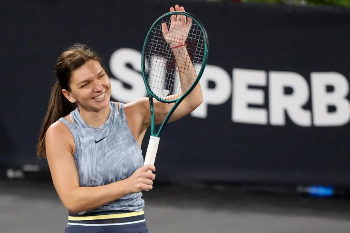 Romania's Simona Halep reacts during an exhibition tennis match at the 5th edition of the Sports Festival organized at the BT Arena in Cluj Napoca, Romania on June 15, 2024.   Simion Sebastian Tataru / AFP