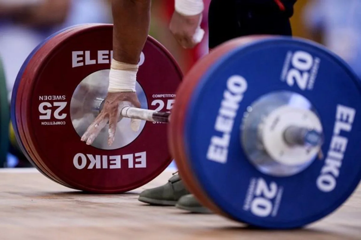 Egyptian Weightlifter Mohamed Mahmoud competes during the Men's 77 Kg Finals Snatch - Group A at the weightlifting contest of the XVIII Mediterranean Games in Constanti, near  Tarragona, on June 25, 2018.   Josep LAGO / AFP