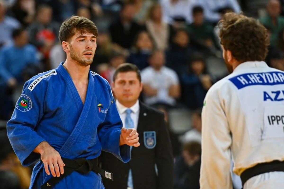 Belgium's Abdul Malik Umayev (white) and Azerbaijan's Hidayat Heydarov (blue) compete in the men's under 73 kg qualifying round during the European Judo Championships 2023 at the Sud de France Arena in Montpellier, southern France, on November 4, 2023. Sylvain THOMAS / AFP