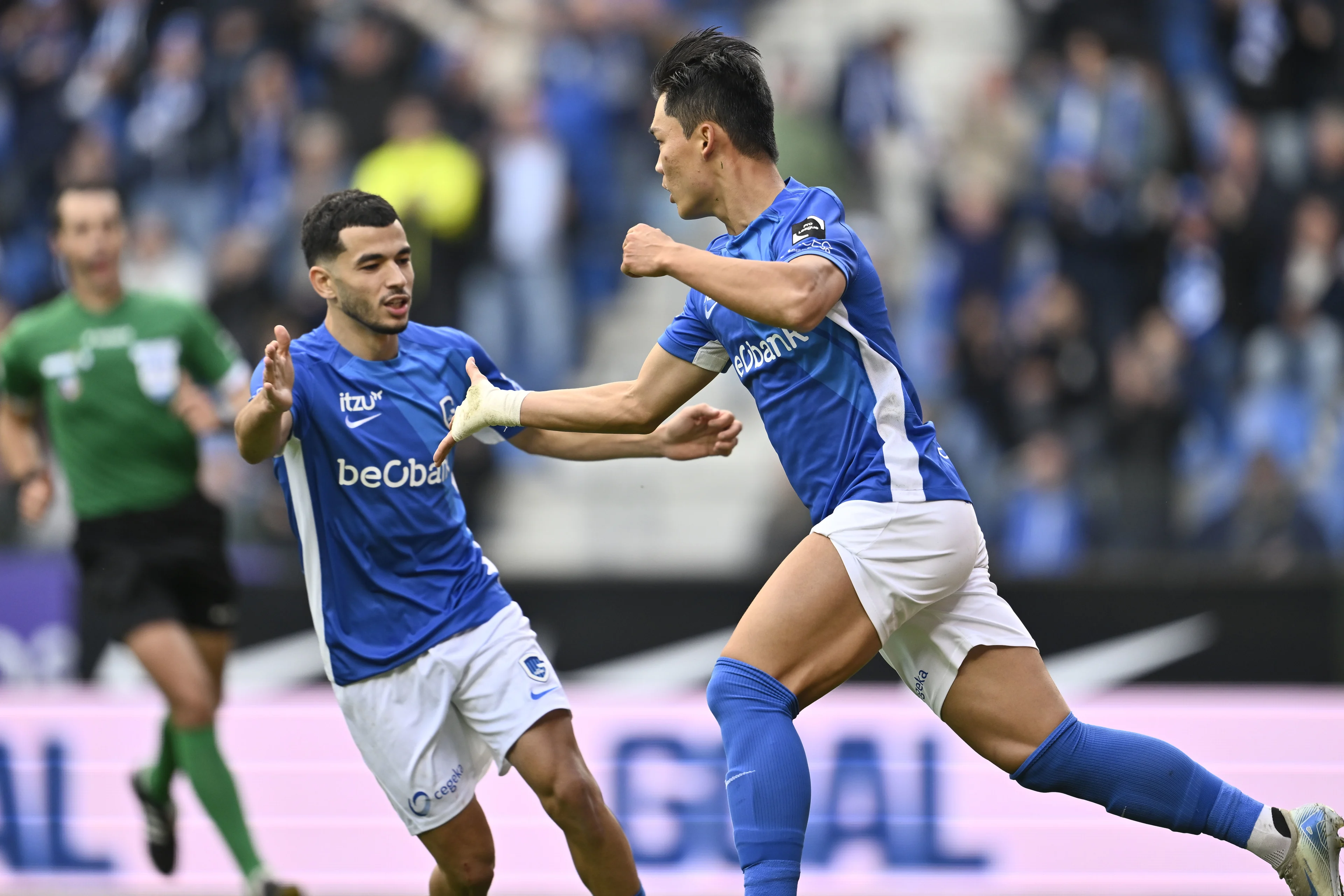 Genk's Zakaria El Ouahdi and Genk's Hyon-Gyu Oh celebrate after scoring during a soccer match between KRC Genk and KV Mechelen, Saturday 28 September 2024 in Genk, on day 9 of the 2024-2025 season of the 'Jupiler Pro League' first division of the Belgian championship. BELGA PHOTO JOHAN EYCKENS