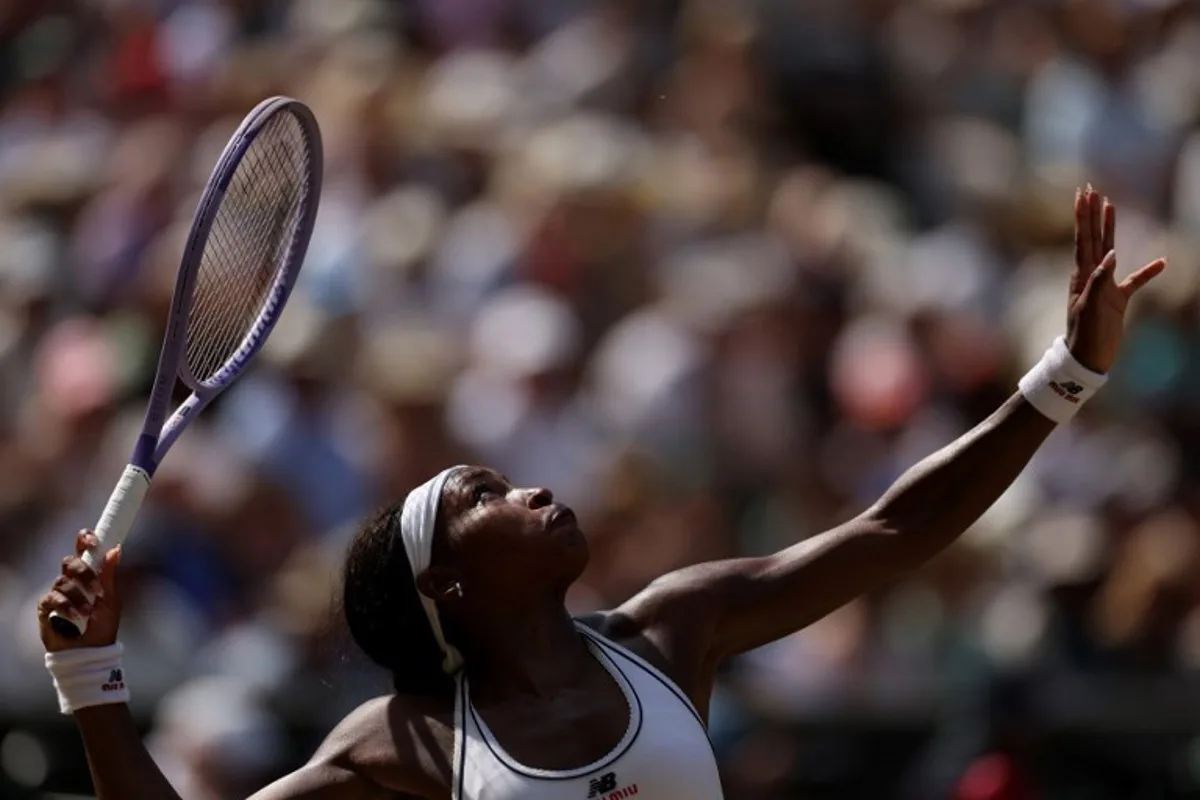 US player Coco Gauff serves to Czech Republic's Karolina Muchova during their women's singles semi-final tennis match on the eleventh day of the 2026 Wimbledon Championships at The All England Lawn Tennis and Croquet Club in Wimbledon, southwest London, on July 9, 2026.  Adrian Dennis / AFP
