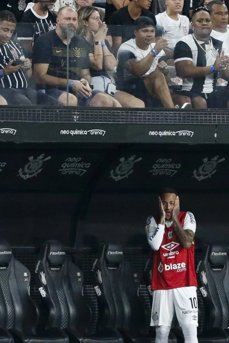 Santos forward #10 Neymar reacts from the bench during Campeonato Paulista A1 semi-final football match between Corinthians and Santos at Arena Corinthians in Sao Paulo on March 9, 2025. Miguel SCHINCARIOL / AFP