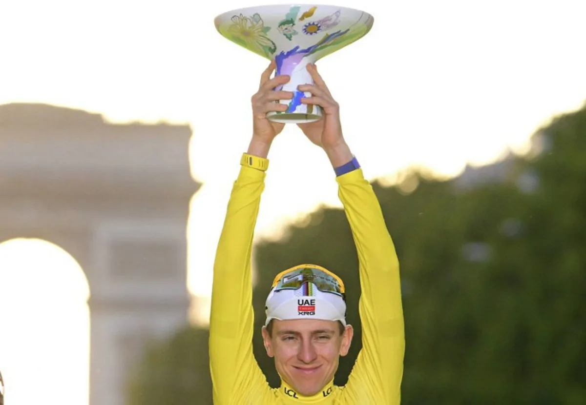 UAE Team Emirates - XRG's Slovenian rider Tadej Pogacar celebrates on the podium with the overall leader's yellow jersey after the 21st stage of the 113th edition of the Tour de France cycling race, 88,7 km starting and finishing in Paris, on July 26, 2026.  Bernard PAPON / POOL / AFP