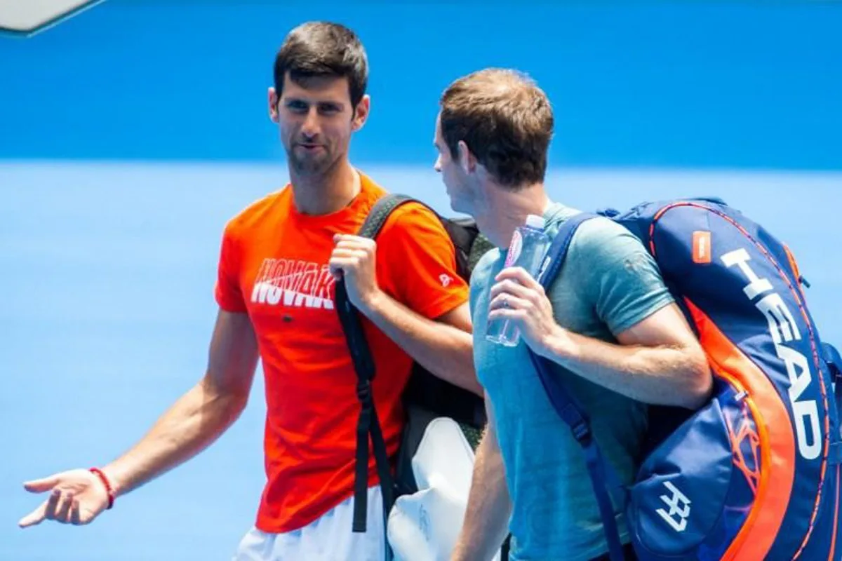 Serbia's Novak Djokovic (L) and Britain's Andy Murray arrive on court during a practice session in Melbourne on January 10, 2019, ahead of the Australian Open tennis tournament.   ASANKA BRENDON RATNAYAKE / AFP -- IMAGE RESTRICTED TO EDITORIAL USE - STRICTLY NO COMMERCIAL USE --

