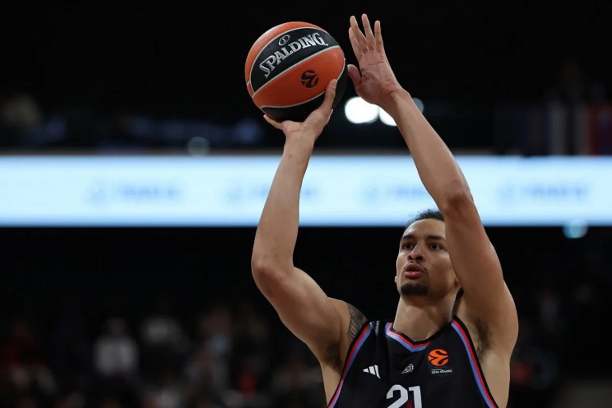 Paris Basketball's Belgian pivot #21 Ismael Bako performs a free throw during the Euroleague basketball match between Paris Basketball and Virtus Bologna at the Adidas Arena, in Paris, on October 9, 2025.  Anne-Christine POUJOULAT / AFP