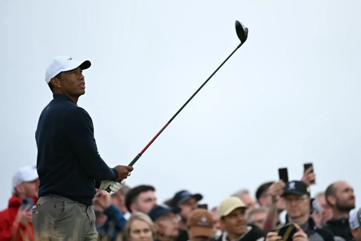 US golfer Tiger Woods watches his drive from the 4th tee during his second round, on day two of the 152nd British Open Golf Championship at Royal Troon on the south west coast of Scotland on July 19, 2024.  Paul ELLIS / AFP