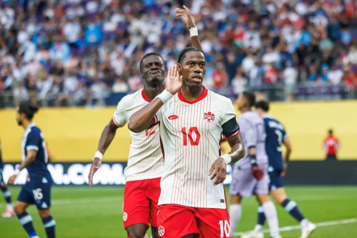 Canada's forward #10 Jonathan David celebrates after scoring a goal during the CONCACAF Gold Cup quarterfinal match between Canada and Guatemala at US Bank Stadium in Minneapolis, Minnesota on June 29, 2025. Kerem YUCEL / AFP