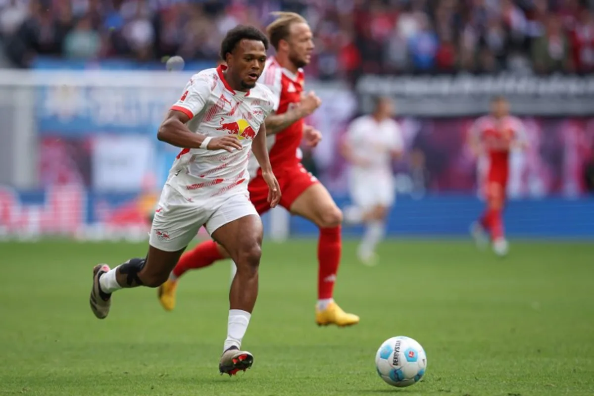 Leipzig's Belgian forward #11 Lois Openda runs with the ball during the German first division Bundesliga football match between RB Leipzig and Union Berlin in Leipzig, eastern Germany, on September 14, 2024.  Ronny HARTMANN / AFP