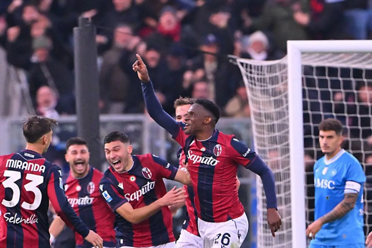 Bologna's Colombian defender #26 Jhon Lucumi (C) celebrates with teammates after scoring during the Italian Serie A football match between Bologna and Napoli at the Renato Dall'Ara stadium in Bologna on April 7, 2025. Andreas SOLARO / AFP
