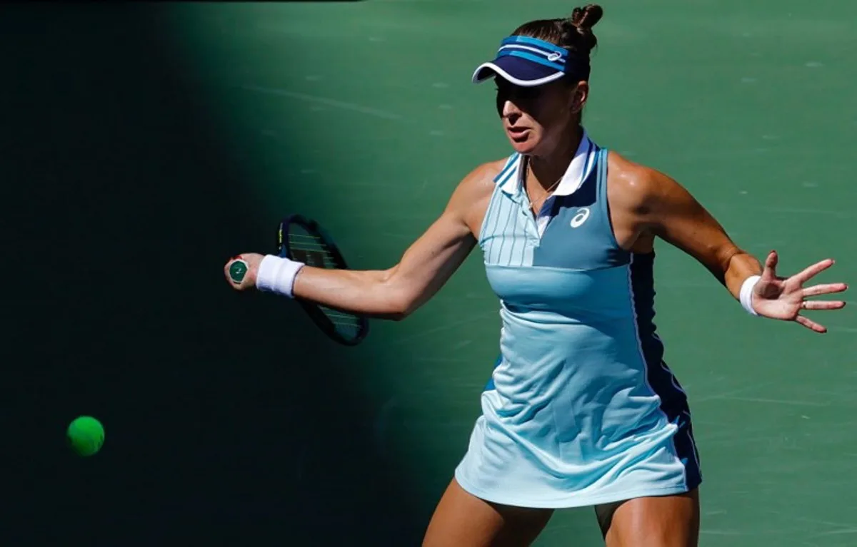 Switzerland's Belinda Bencic hits a return to Romania's Sorana Cirstea during their US Open tennis tournament women's singles round of 16 match at the USTA Billie Jean King National Tennis Center in New York City, on September 3, 2023.  Kena Betancur / AFP