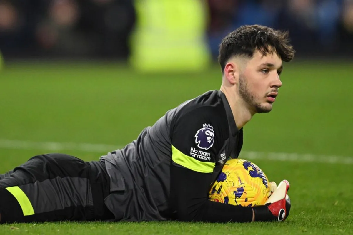 Burnley's English goalkeeper #01 James Trafford gathers the ball during the English Premier League football match between Burnley and Luton Town at Turf Moor in Burnley, north-west England on January 12, 2024. Oli SCARFF / AFP