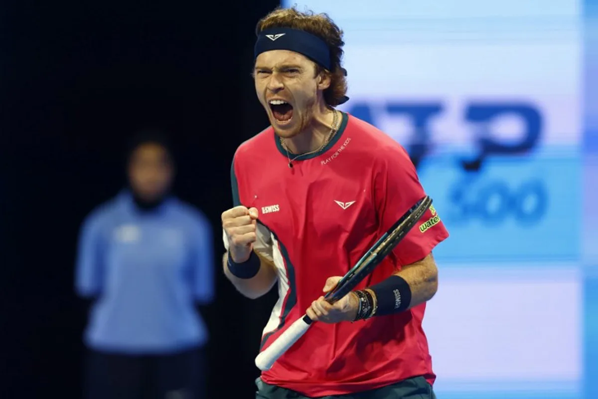 Russia's Andrey Rublev reacts after winning his first set during the ATP Qatar Open tennis tournament final match against Britain's Jack Draper in Doha on February 22, 2025.  KARIM JAAFAR / AFP