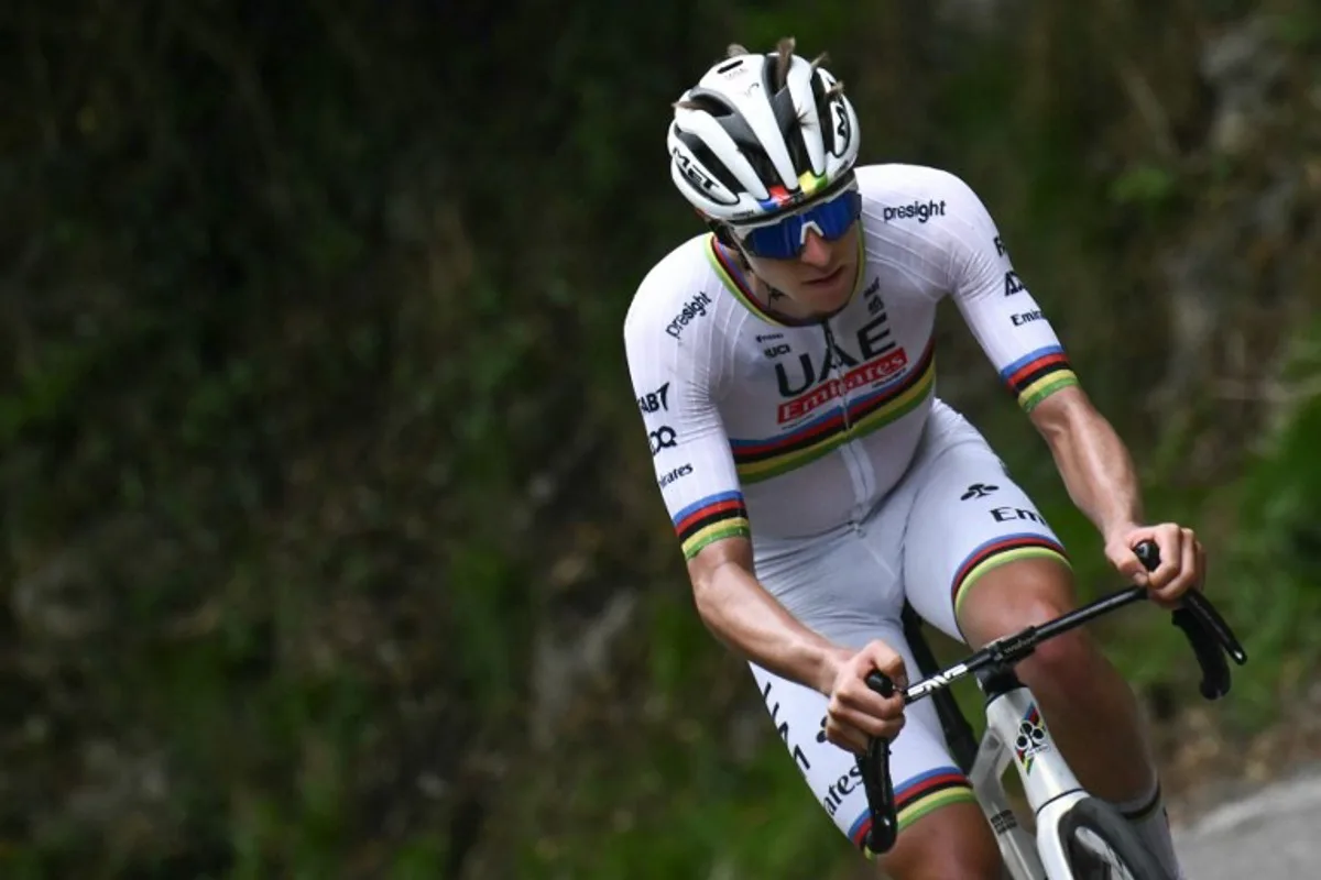 UAE Team Emirates team's Slovenian rider Tadej Pogacar attacks, to take the lead in a lone breakaway in the Colma Di Sormano ascent during the 118th edition of the Giro di Lombardia (Tour of Lombardy), a 252km cycling race from Bergamo to Como on October 12, 2024.  Marco BERTORELLO / AFP