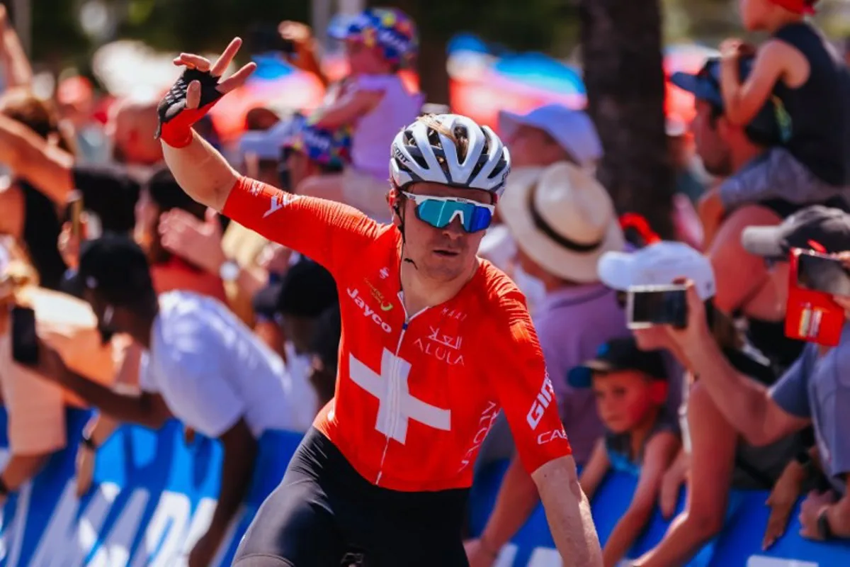 Switzerland's Mauro Schmid of Team Jayco Alula crosses the line to win the 2025 Cadel Evans Great Ocean Men's Elite Road Race in Geelong on February 2, 2025.  CHRIS PUTNAM / AFP