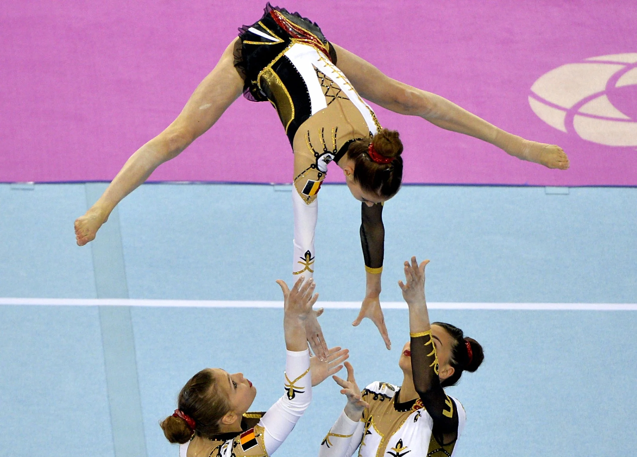 20150619 - BAKU, AZERBAIJAN: Belgian gymnast Julie Van Gelder, Belgian gymnast Ineke Van Schoor and Belgian gymnast Kaat Dumarey pictured in action during the acrogym acrobatic gymnastics final, women's group, All-Around, at the European Games 2015, in Baku, Azerbaijan, Friday 19 June 2015. The European Games 2015 multi-sport event takes place from 12 to 28 June. The Belgan women won the gold medal. BELGA PHOTO ERIC LALMAND