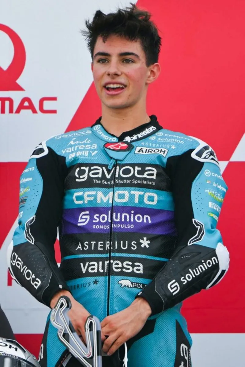 Winner CFMOTO Aspar Team's Colombian rider David Alonso celebrates on the podium after the Moto3 class race of the MotoGP Pramac Emilia-Romagna Grand Prix at the Misano World Circuit Marco-Simoncelli in Misano Adriatico, on September 22, 2024.  Andreas SOLARO / AFP