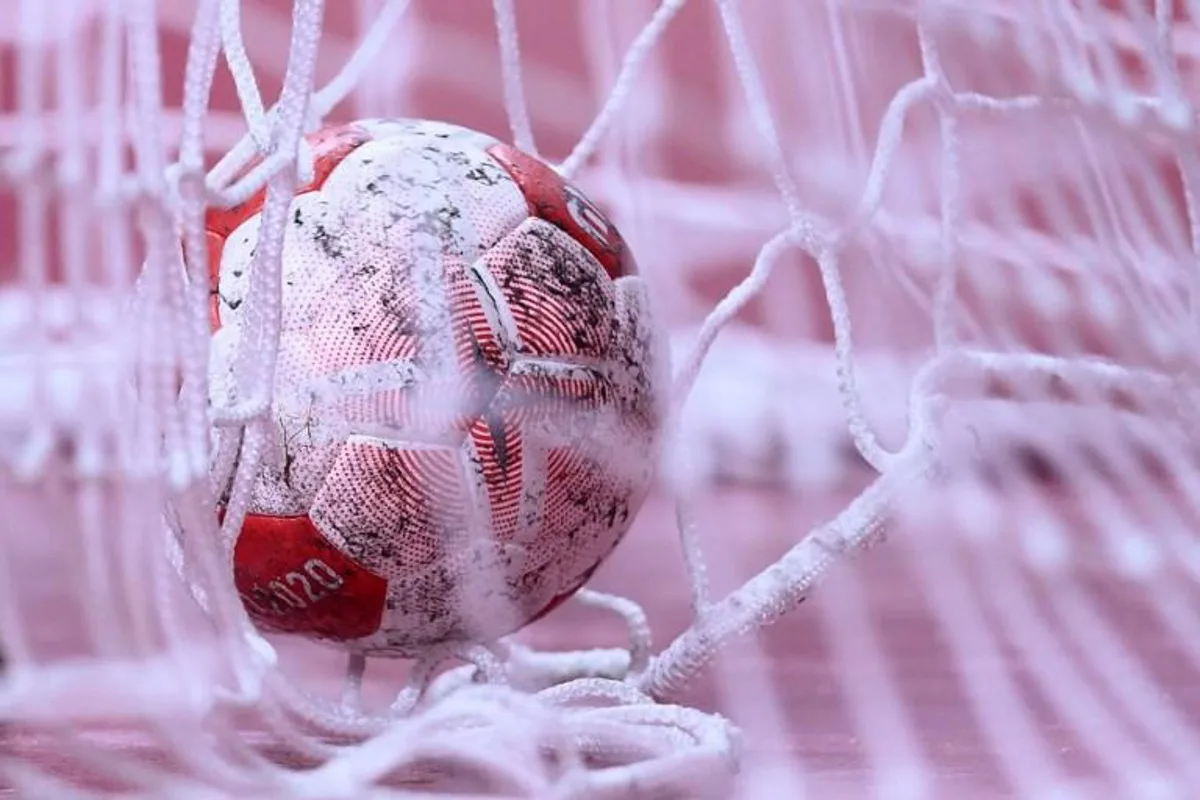 The ball is seen in the net during the men's preliminary round group A handball match between Spain and Argentina of the Tokyo 2020 Olympic Games at the Yoyogi National Stadium in Tokyo on August 1, 2021.  Franck FIFE / AFP