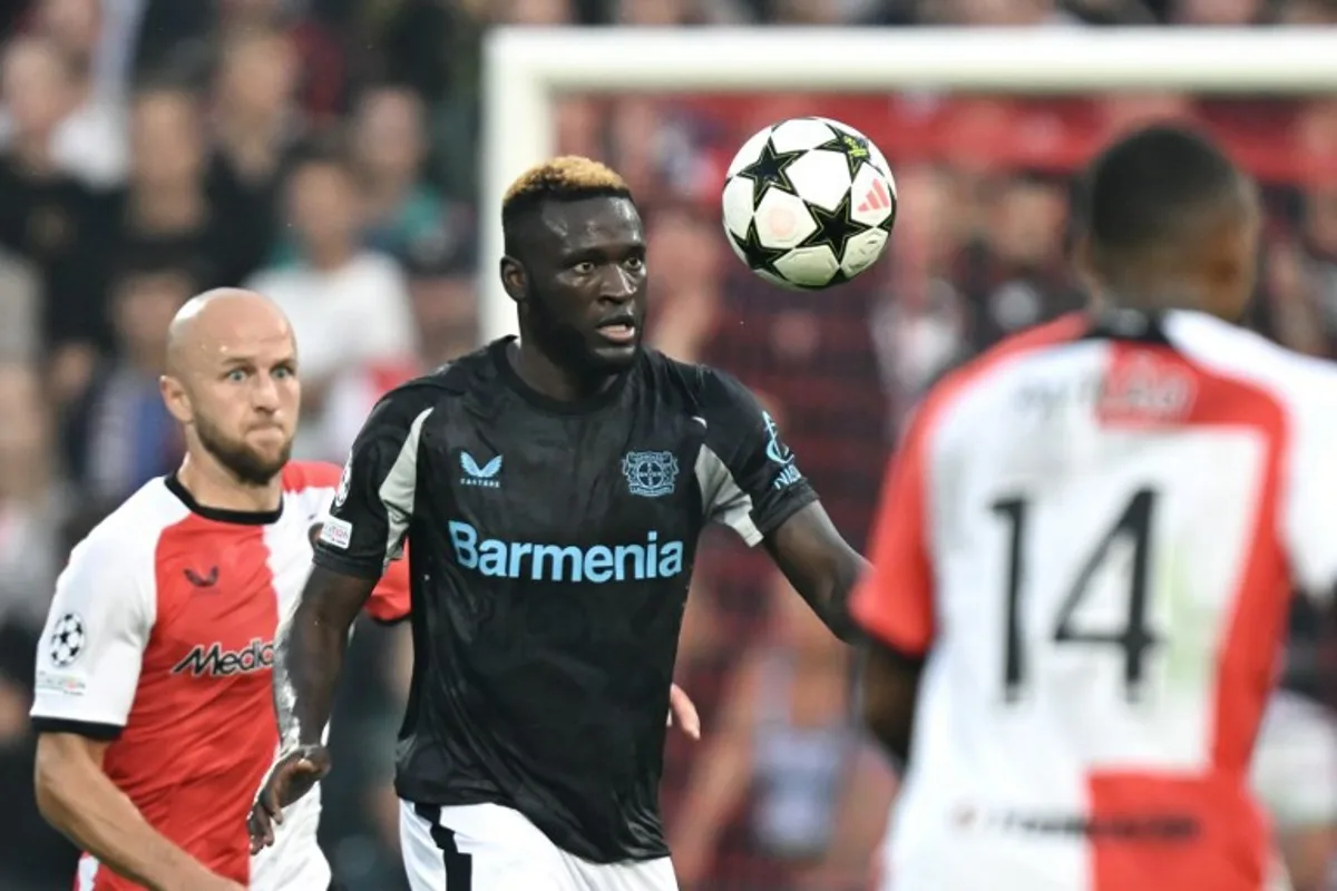 Bayer Leverkusen's Nigerian forward #22 Victor Boniface controls the ball during the UEFA Champions League 1st round day 1 football match between Feyenoord  and Bayer Leverkusen at The De Kuip Stadium, in Rotterdam on September 19, 2024.  JOHN THYS / AFP