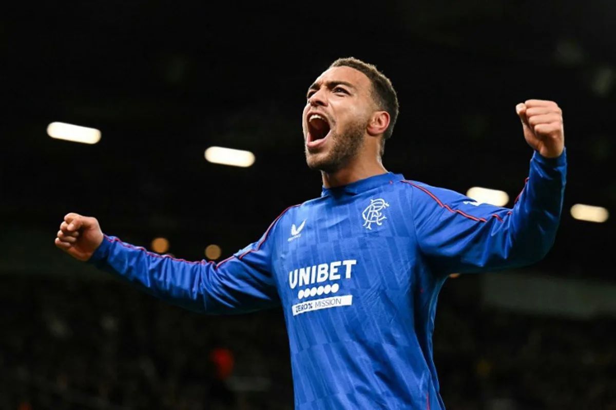 Rangers' Belgian-born Nigerian striker #09 Cyriel Dessers celebrates after scoring his team first goal during the UEFA Europa league football match between Manchester United and Glasgow Rangers at Old Trafford stadium in Manchester, north west England, on January 23, 2025. Oli SCARFF / AFP