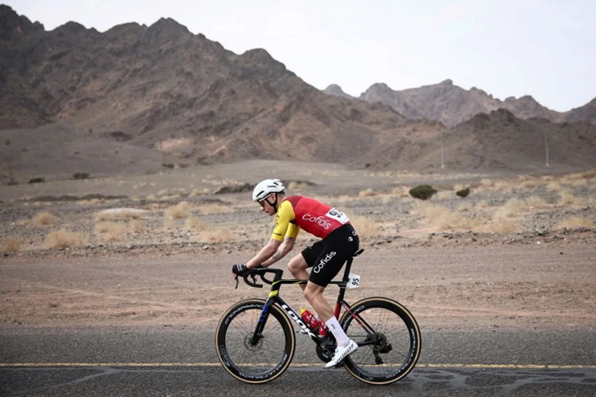 Cofidis cycling team's French Hugo Page rides during the first stage of the AlUla Tour cycling race, a 158 km race started and finished in the Saudi desert city of AlUla, on January 27, 2026. Anne-Christine POUJOULAT / AFP