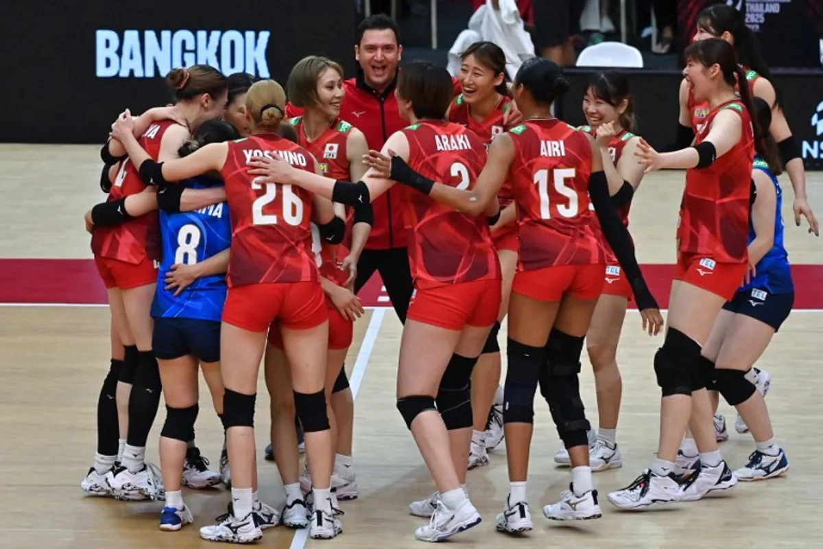 Team Japan celebrates beating the Netherlands in their 2025 Women's Volleyball World Championships quarter-final match in Bangkok on September 3, 2025. Amaury PAUL / AFP