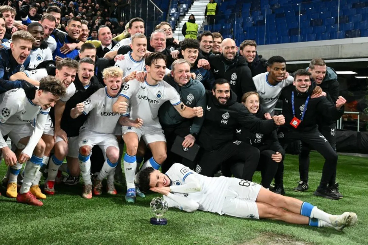 Brugge's players celebrate winning the UEFA Champions League knockout phase play-off 2nd leg football match between Club Brugge KV and Atalanta at the Stadio di Bergamo in Bergamo on February 18, 2025.  Alberto PIZZOLI / AFP