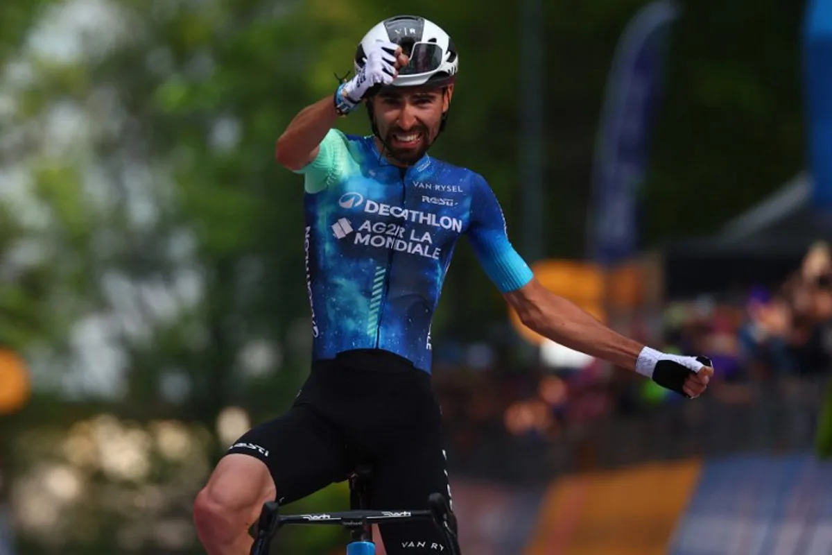 Team Decathlon AG2R's French rider Valentin Paret-Peintre celebrates as he crosses the finish line to win the 10th stage of the 107th Giro d'Italia cycling race, 142km between Pompei and Cusano Mutri (Bocca della Selva), on May 14, 2024.   Luca Bettini / AFP