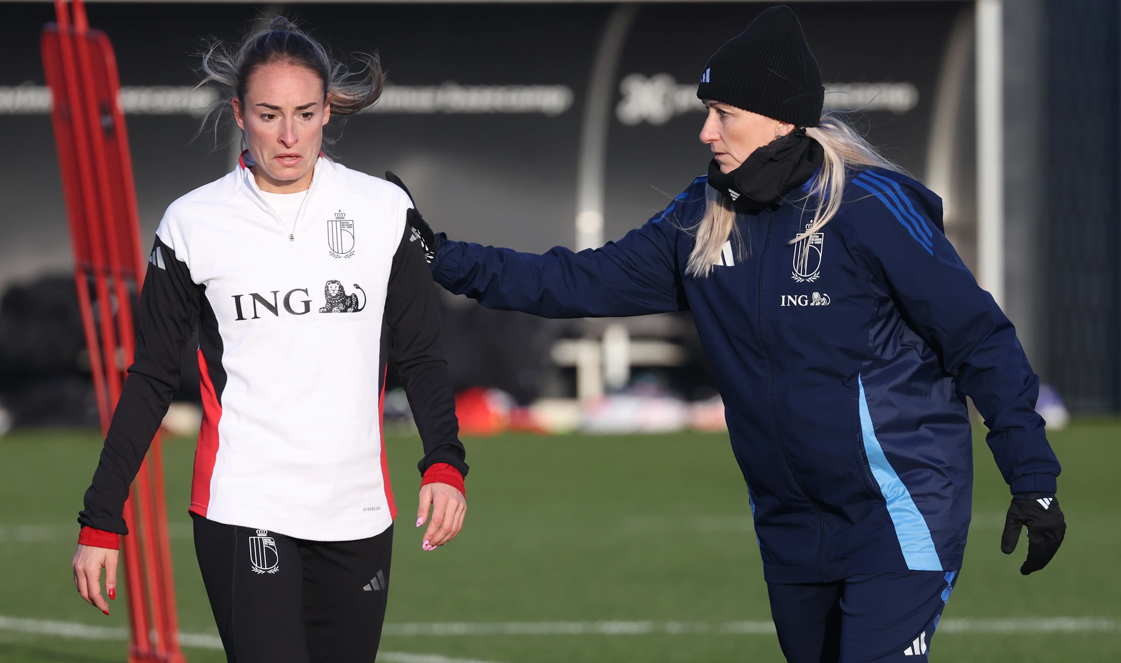 Belgium's Tessa Wullaert and Belgium's head coach Elisabet Gunnarsdottir pictured during a training session of Belgium's national women's team the Red Flames ahead of Nations League soccer games against Spain and Portugal, on Tuesday 18 February 2025 in Tubize. BELGA PHOTO VIRGINIE LEFOUR