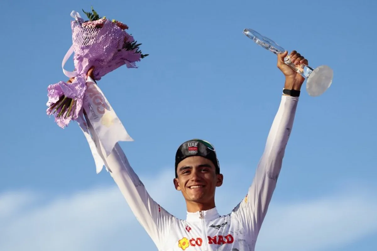 UAE Team Emirates XRG's Mexican rider Isaac Del Toro wearing the best young rider's white jersey (Maglia Bianca) celebrates on the podium at the end of the 21st and last stage of the 108th Giro d'Italia cycling race of 143kms from Rome to Rome on June 1, 2025. Luca Bettini / AFP