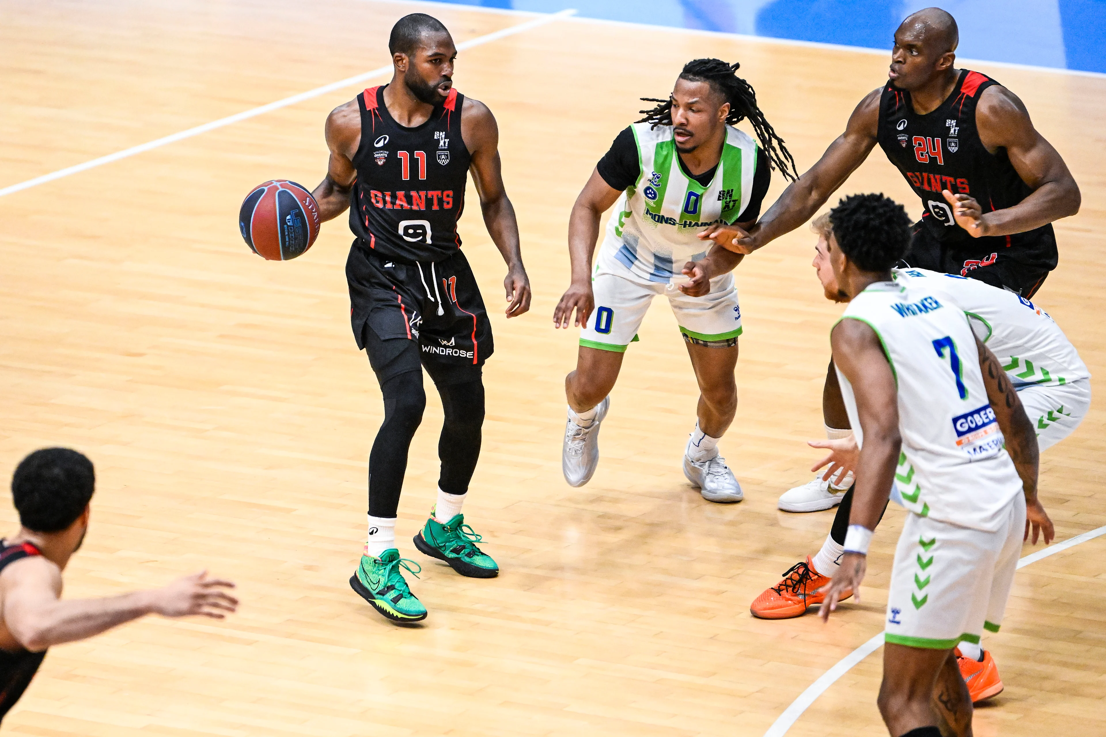 Antwerp's Joel Murray, Mons' Gregory Milton and Antwerp's Kevin Tumba pictured in action during a basketball match between Union Mons-Hainaut and Antwerp Giants, Saturday 02 May 2026 in Mons, on matchday 32/34 in the 'BNXT League' Belgian/ Dutch first division basket championship. BELGA PHOTO TOM GOYVAERTS