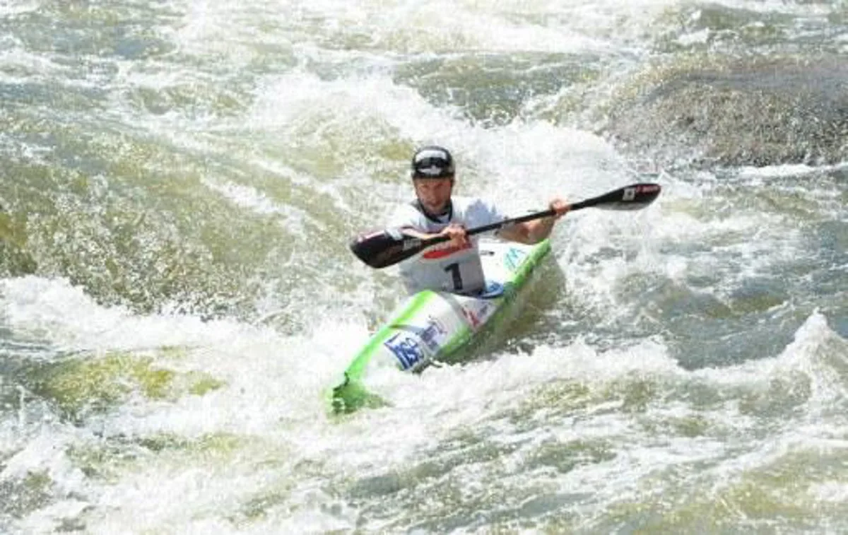 Slovenian Nejc Znidarcic competes in the Kayak K1 men race at the ICF Wildwater Canoeing Sprint World in the southern German city of Augsburg, on June 12, 2011. AFP PHOTO/CHRISTOF STACHE