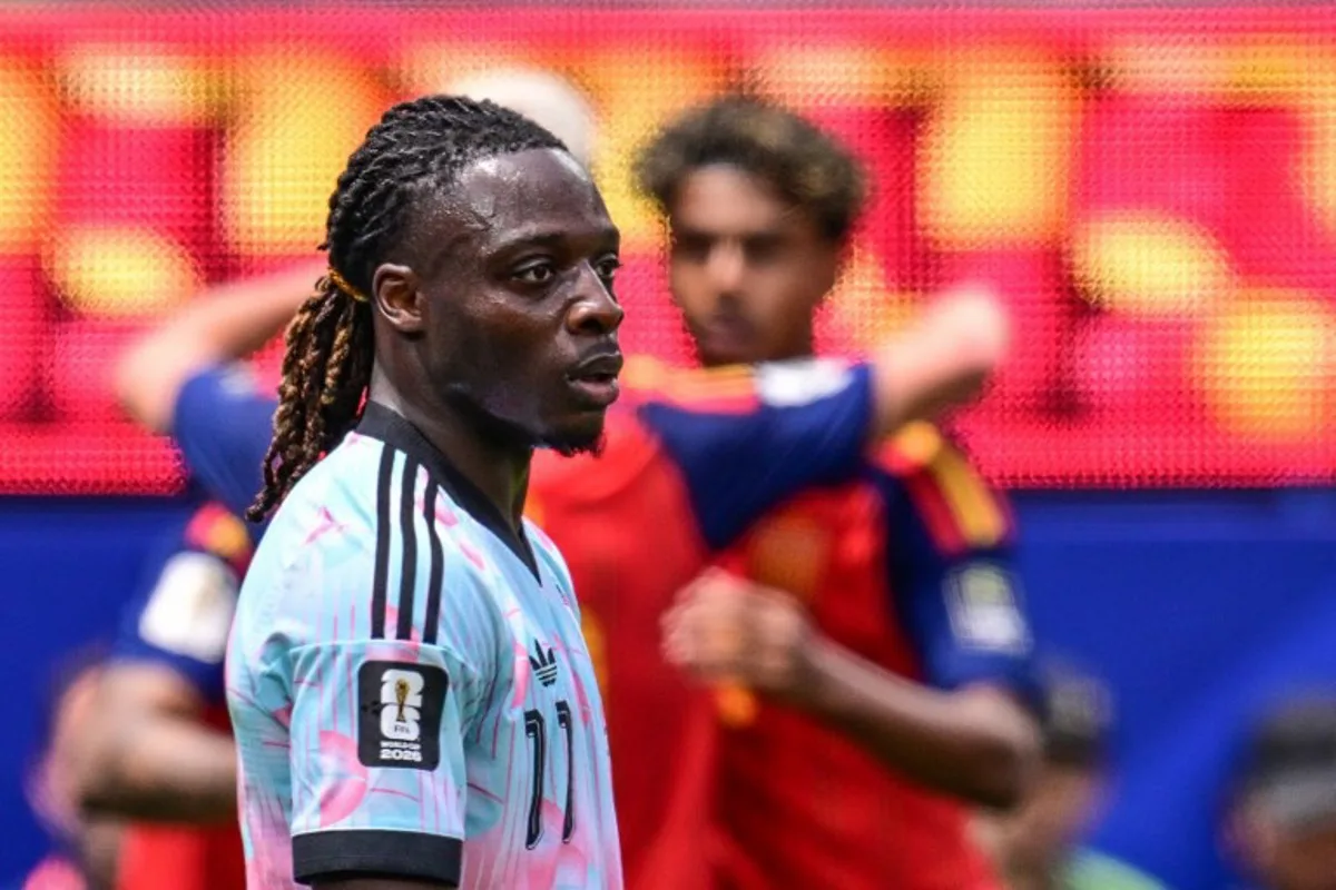 Belgium's forward #11 Jeremy Doku reacts after Spain's midfielder #08 Fabian Ruiz scores his team's first goal during the 2026 World Cup football tournament quarter-final match between Spain and Belgium at the Los Angeles Stadium in Inglewood on July 10, 2026.   Frederic J. Brown / AFP