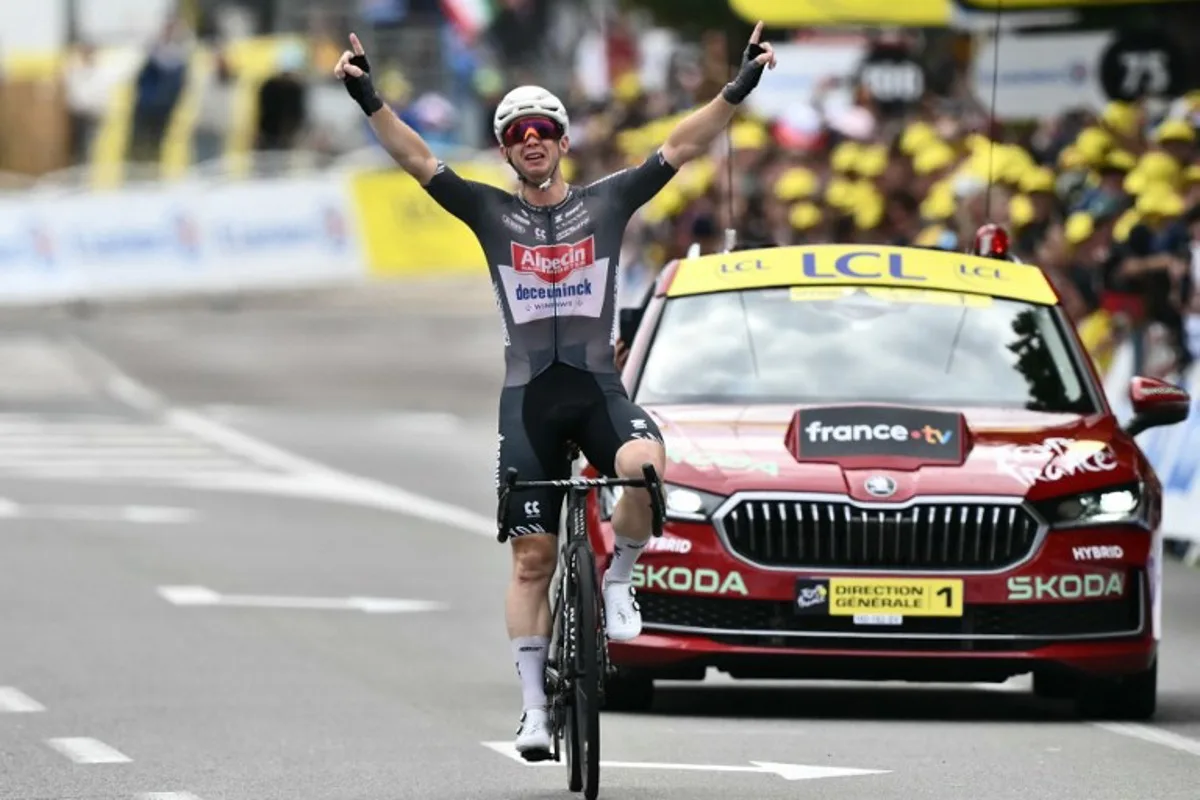 Alpecin - Deceuninck team's Australian rider Kaden Groves cycles to the finish line to win the 20th stage of the 112th edition of the Tour de France cycling race, 184.2 km between Nantua and Pontarlier, in the Jura, eastern France, on July 26, 2025. Marco BERTORELLO / AFP