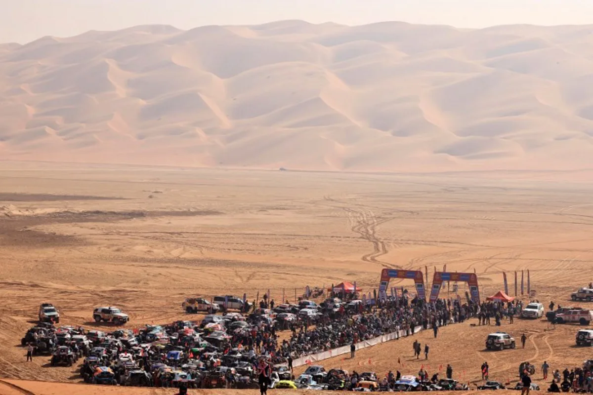 Competitors gather at the start, delayed due to foggy conditions, of Stage 11 of the Dakar Rally 2025, between Shubaytah and Shubaytah, Saudi Arabia, on January 16, 2025.  Valery HACHE / AFP