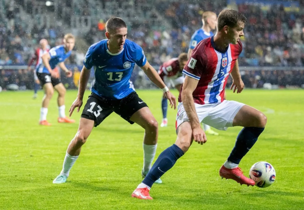 Norway's defender #05 David Moller Wolfe (R) and Estonia's defender #13 Maksim Paskotsi vie for the ball during the FIFA World Cup 26 UEFA Qualifying football match between Estonia and Norway in Tallinn on June 9, 2025. RAIGO PAJULA / AFP