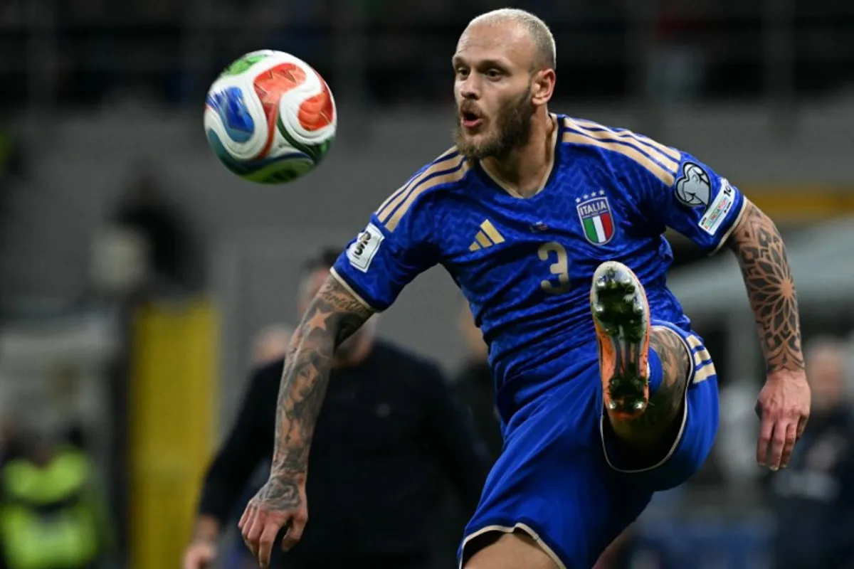 Italy's defender #03 Federico Dimarco controls the ball during the FIFA World Cup 2026 European qualification football match between Italy and Norway, at the San Siro Stadium, in Milan, on November 16, 2025. Stefano RELLANDINI / AFP