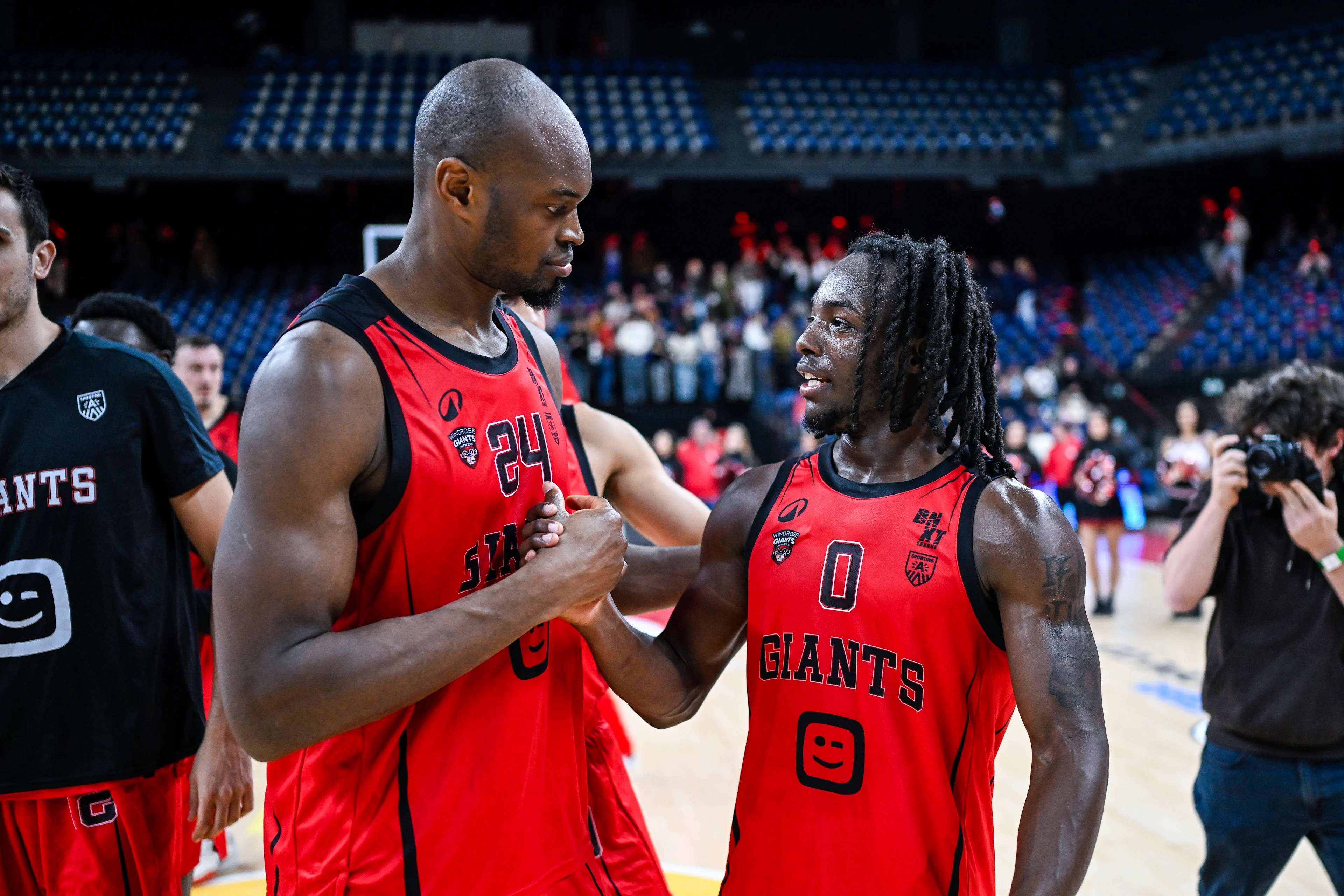 Antwerp's Kevin Tumba and Antwerp's Rasheed Bello celebrate after winning a basketball match between Antwerp Giants and Okapi Aalst, Friday 07 November 2025 in Antwerp, on day 7 of the 'BNXT League' Belgian/ Dutch first division basket championship. BELGA PHOTO TOM GOYVAERTS
