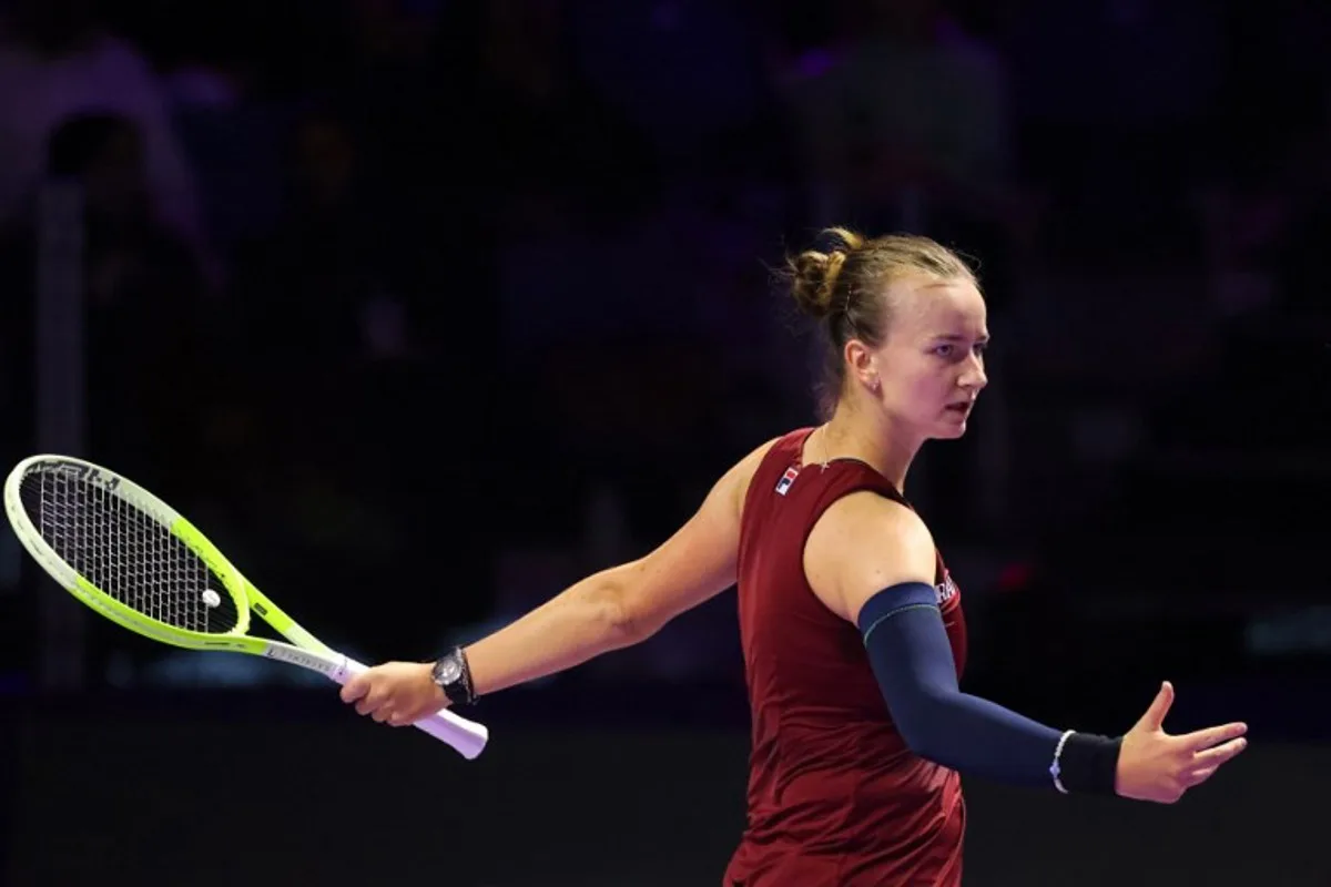 Czech Republic's Barbora Krejcikova reacts after a point against US' Coco Gauff during their women's singles tennis match at the WTA Finals Championship in Riyadh on November 7, 2024.  Fayez NURELDINE / AFP