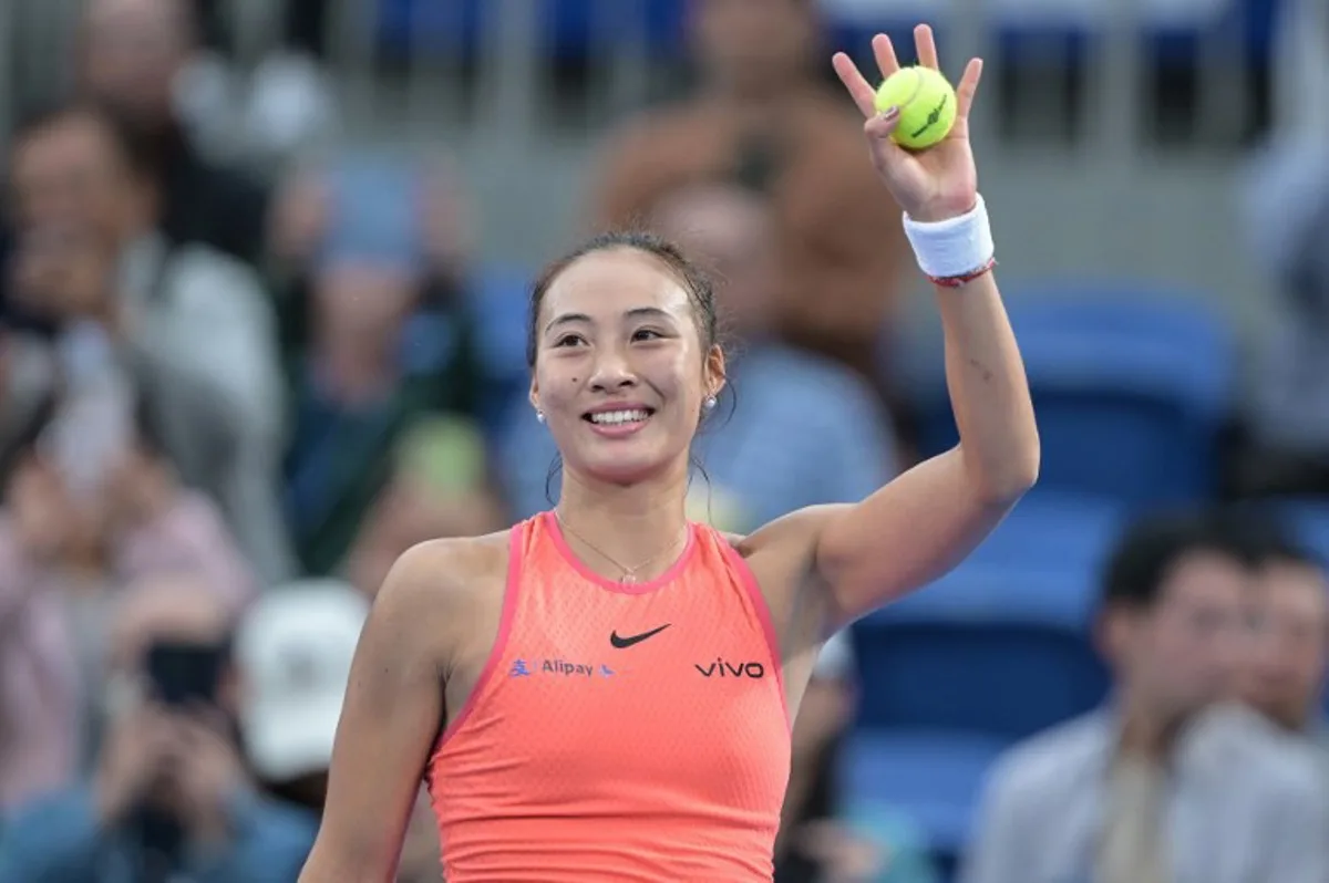 China's Zheng Qinwen celebrates her victory over Russia's Diana Shnaider at the end of their women's singles semifinal match on day six of the Pan Pacific Open tennis tournament in Tokyo on October 26, 2024.   Richard A. Brooks / AFP