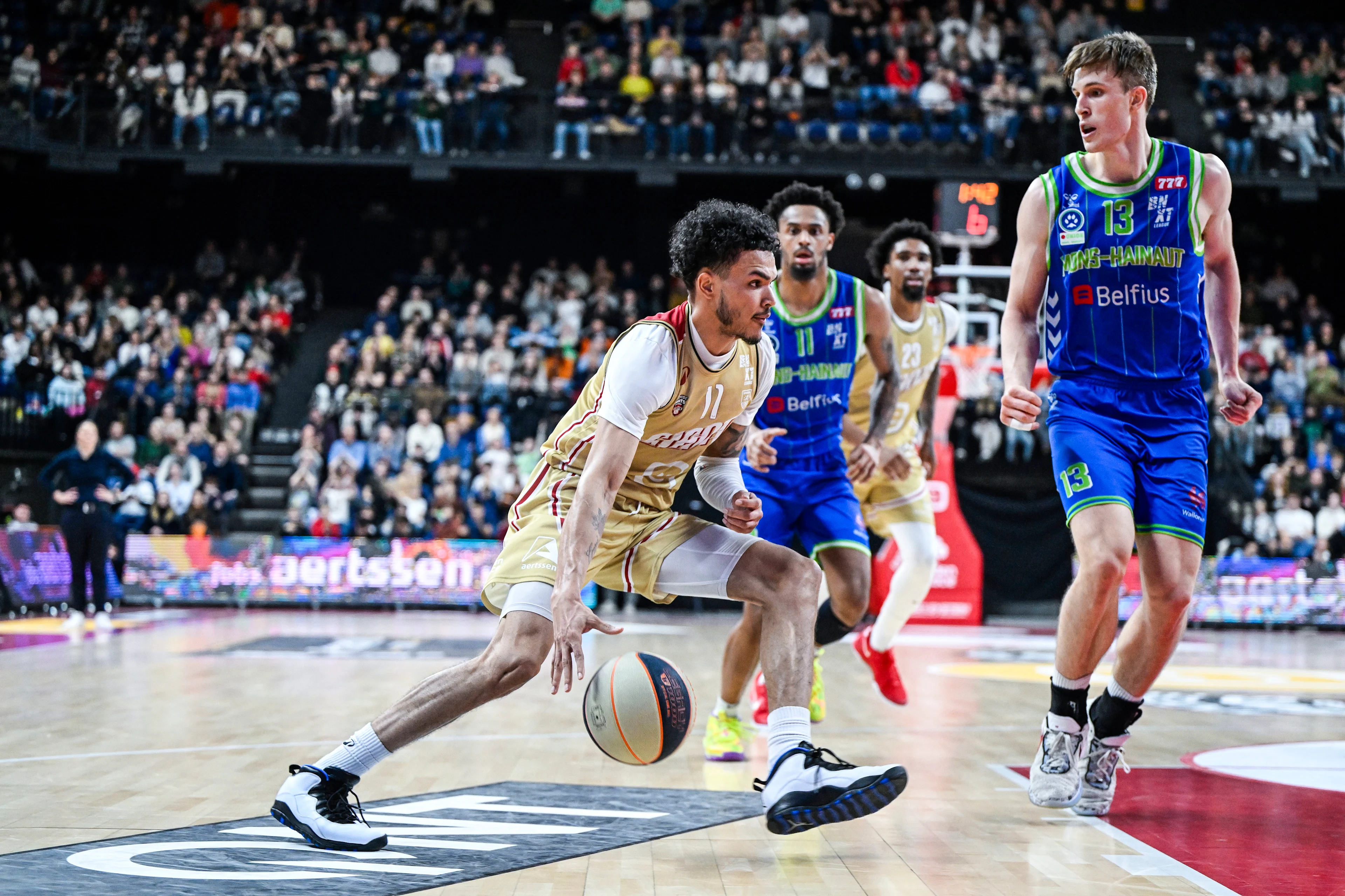 Antwerp's Kyle Foster and Mons' James Moors pictured in action during a basketball match between Antwerp Giants and Mons-Hainaut, Friday 13 December 2024 in Antwerp, on day 5 of the 'BNXT League' first division basket championship. BELGA PHOTO TOM GOYVAERTS