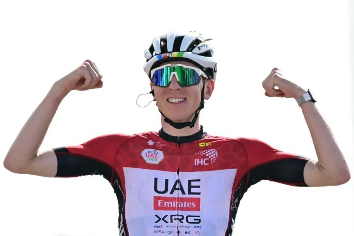 UAE Team Emirates' Slovenian rider Tadej Pogacar celebrates as he crosses the finish line at the end of the seventh stage of the UAE Tour cycling race from Hazza Bin Zayed Stadium to Jebel Hafeet in the United Arab Emirates, on February 23, 2025.  Giuseppe CACACE / AFP