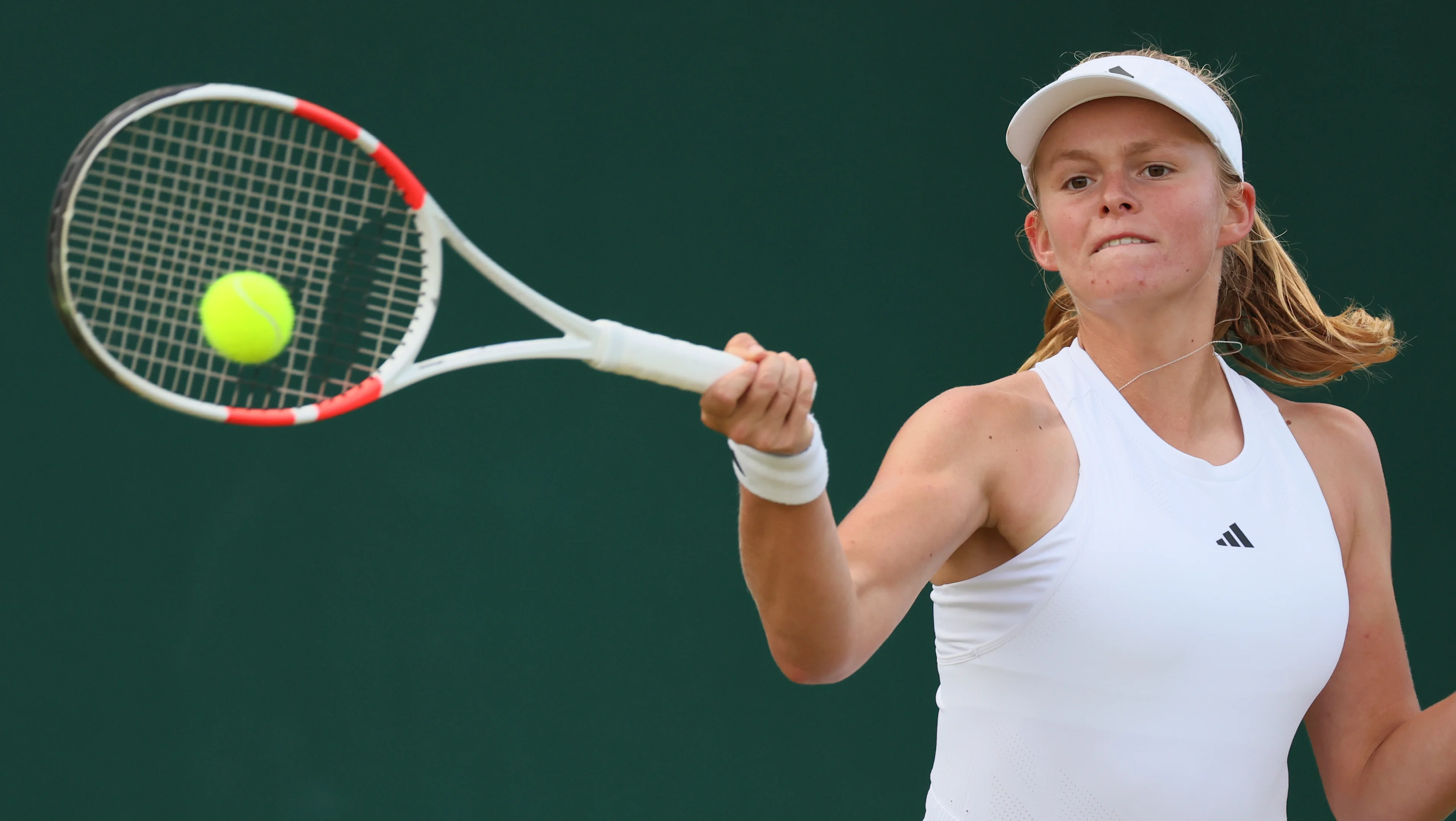 Belgian Jeline Vandromme pictured in action during a tennis match between Belgian Vandromme and Korean Jang, in round 1 of the girls singles of the 2024 Wimbledon grand slam tournament at the All England Tennis Club, in south-west London, Britain, Sunday 07 July 2024. BELGA PHOTO BENOIT DOPPAGNE