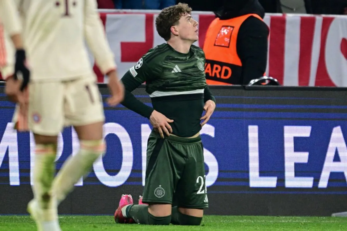 Celtic's Belgian midfielder #27 Arne Engels reacts after the UEFA Champions League second-leg, knockout phase play-off match FC Bayern Munich vs Celtic on February 18, 2025 in Munich.  Tobias SCHWARZ / AFP