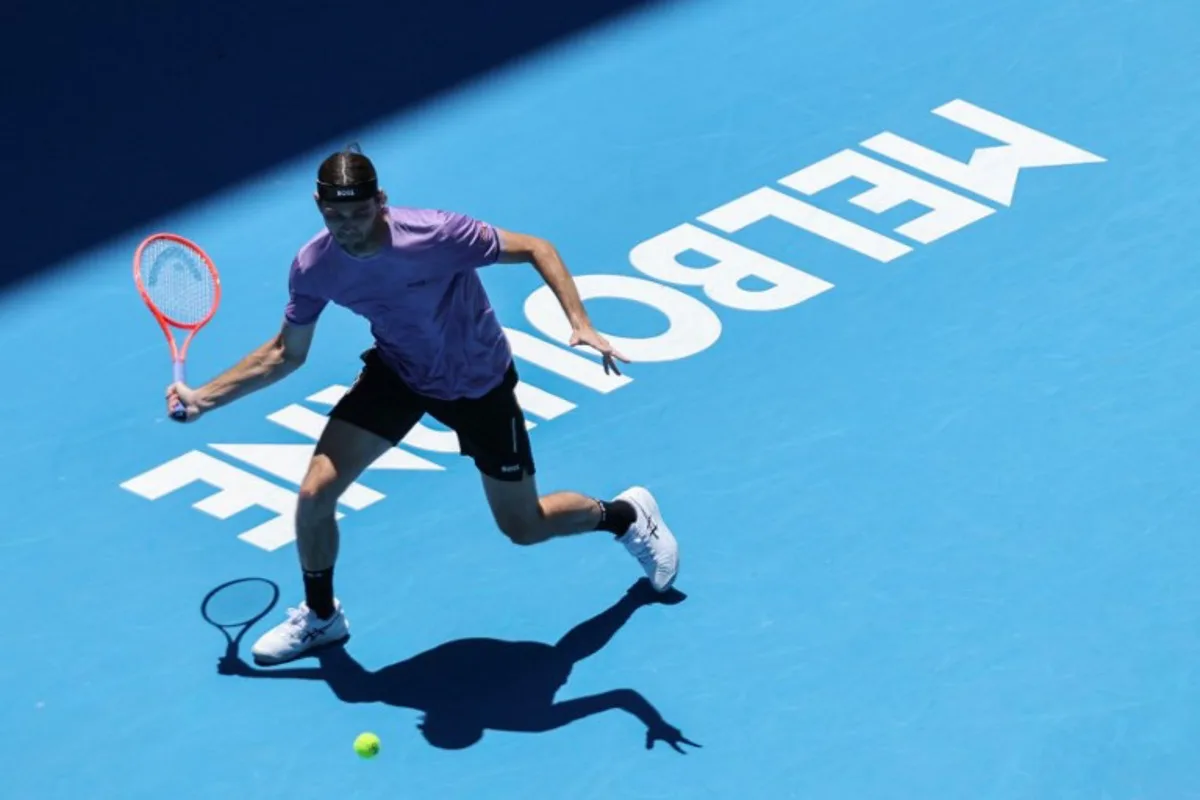 USA's Taylor Fritz hits a return against compatriot Jenson Brooksby during their men's singles match on day three of the Australian Open tennis tournament in Melbourne on January 14, 2025.  Adrian DENNIS / AFP