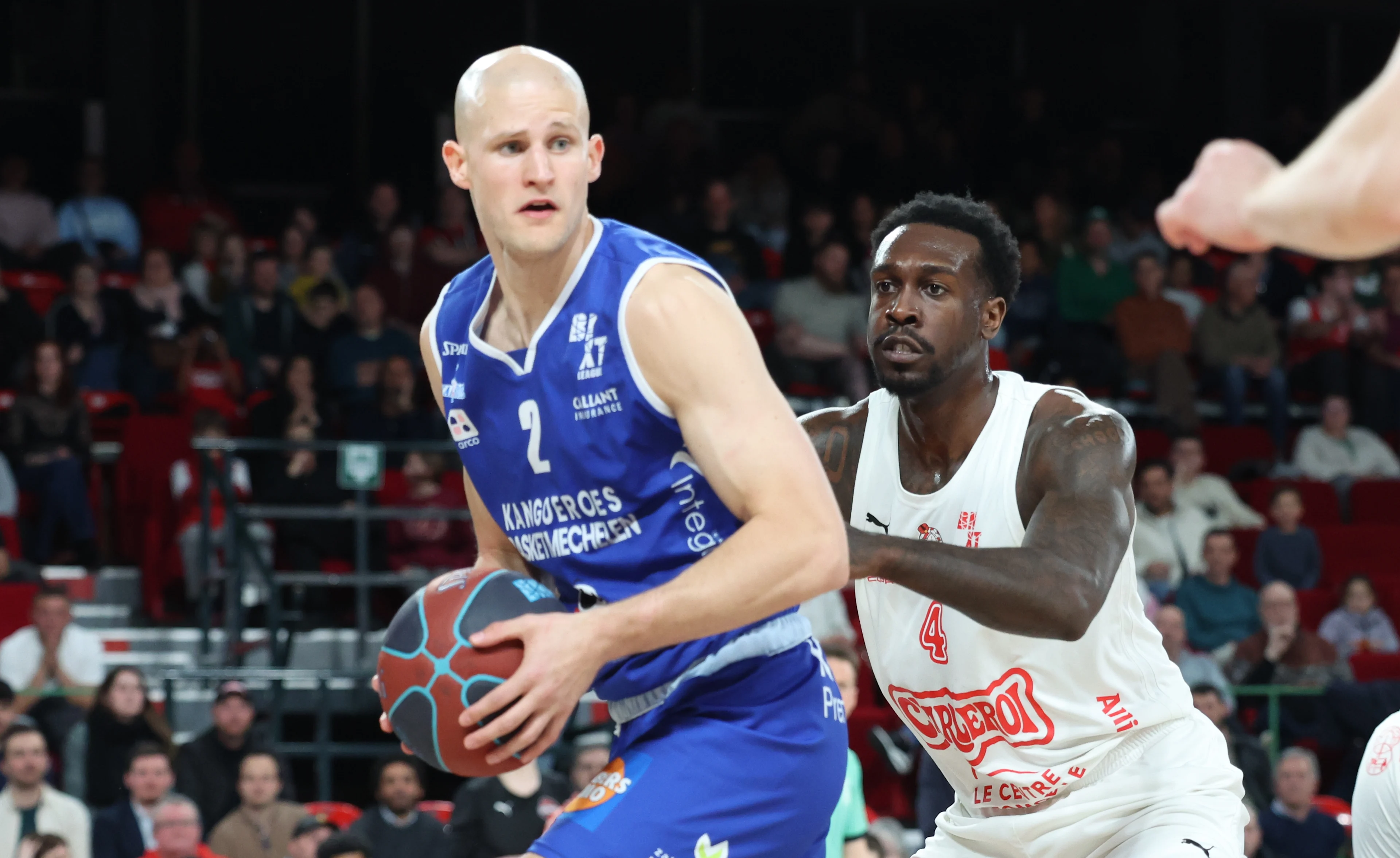 Mechelen's Yannick Dammen and Spirou's Juwan Gary fight for the ball during a basketball match between Spirou Charleroi and Kangoeroes Basket Mechelen, Friday 27 March 2026 in Charleroi, on day 25 of the 'BNXT League' Belgian and Dutch first division basket championships. BELGA PHOTO VIRGINIE LEFOUR