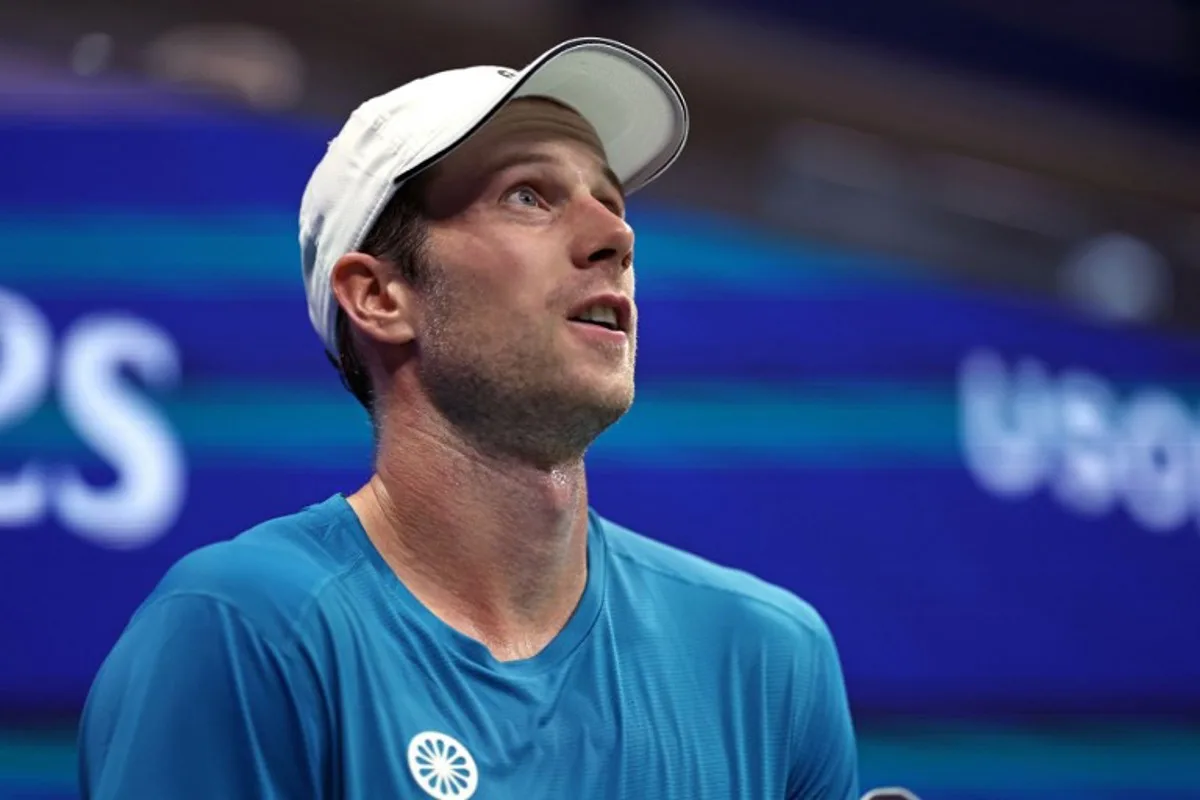 Netherlands' Botic van De Zandschulp looks on after a point against Spain's Carlos Alcaraz during their men's singles second round tennis match on day four of the US Open tennis tournament at the USTA Billie Jean King National Tennis Center in New York City, on August 29, 2024.  CHARLY TRIBALLEAU / AFP